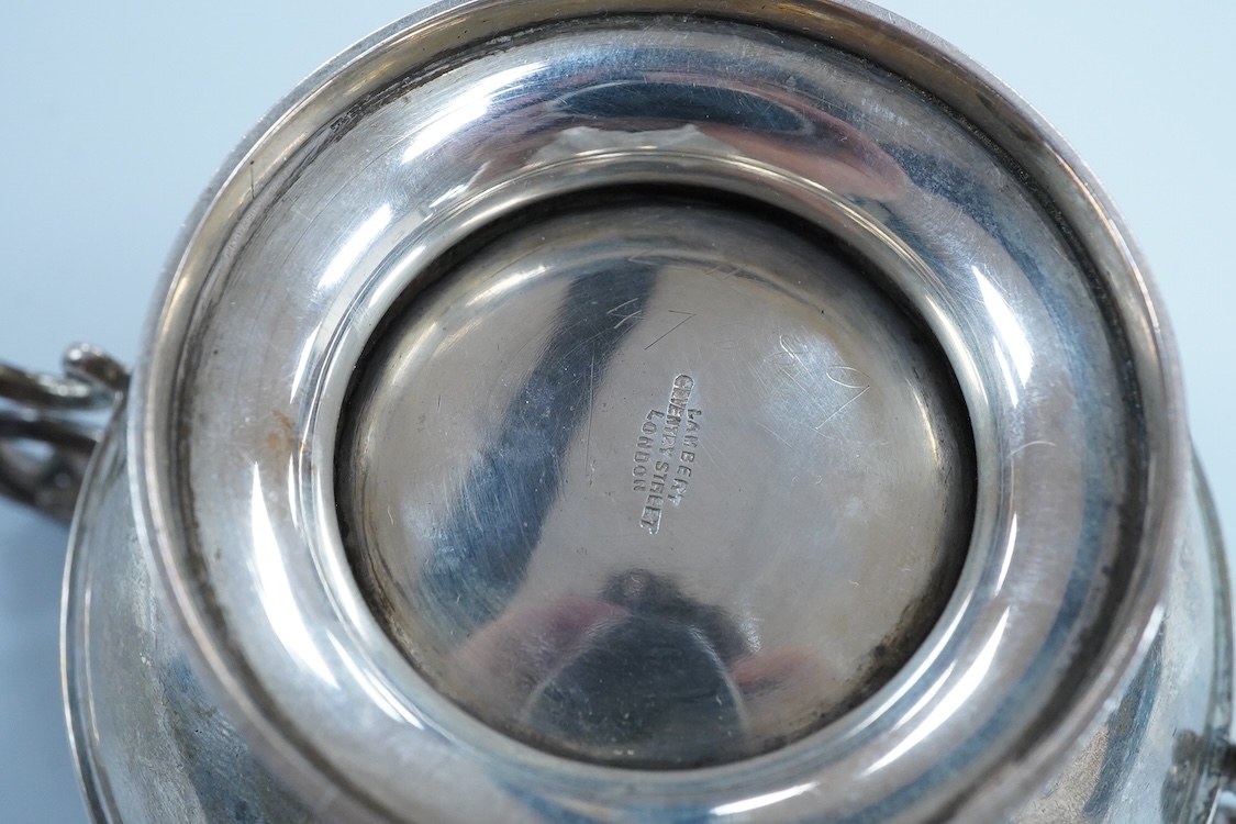 An Edwardian silver two handled pedestal bowl, by Lambert & Co, London, 1909, with later engraved inscription, diameter 10.5cm excluding the handles, 7.2oz.